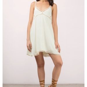 Cute cream v neck shift dress with a ladder trim